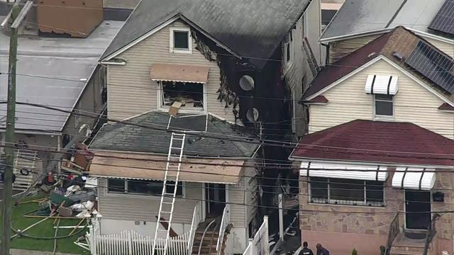 An aerial view of a home in the Bronx that appears to have significant fire damage. 