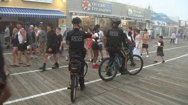 Police officers on bicycles patrol on the Ocean City boardwalk in New Jersey 