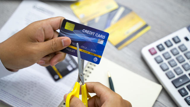 Scissors cutting a credit card 