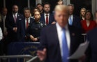 Sen. J.D. Vance listens as former U.S. President Donald Trump speaks to the media at his trial for allegedly covering up hush money payments at Manhattan Criminal Court on May 13, 2024 in New York City. 