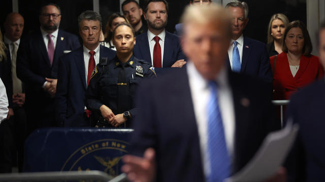 Sen. J.D. Vance listens as former U.S. President Donald Trump speaks to the media at his trial for allegedly covering up hush money payments at Manhattan Criminal Court on May 13, 2024 in New York City. 