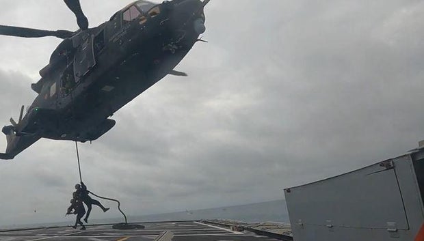 Soldiers rappel onto the deck of a moving warship during the annual US-led Flintlock training exercises for African forces, hosted this year by Ghana, in late May 2024.