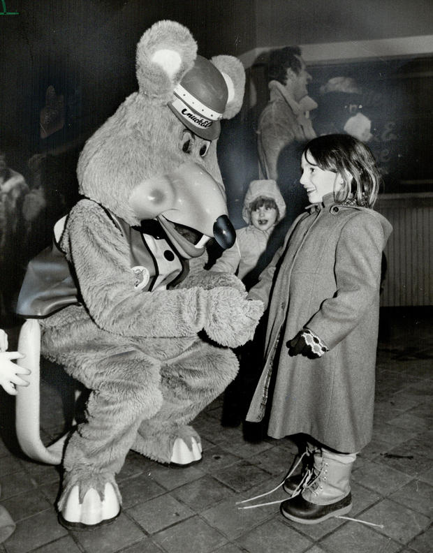 Say cheese: This little girl smells a rat. Actually a man in a rat's suit. Adam Roberts; the man ins 
