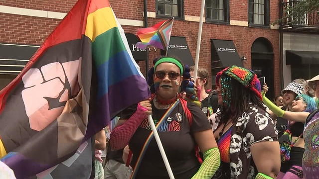 A person holds a pride flag at the Pride March in Philadelphia 