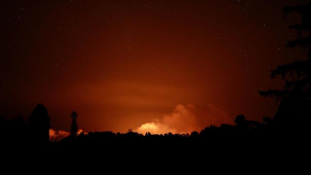 The plume from Kīlauea volcano's eruption is seen during the early morning hours of June 3, 2024. 