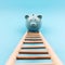 Piggy Bank Climbing a Stair 