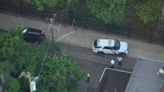 An overhead shot from Chopper 3 showing a police car and some officers in an area cordoned off by yellow police tape 