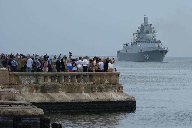 People watch Russian frigate Admiral Gorshkov as it enters Havana's harbor in Cuba, June 12, 2024. 