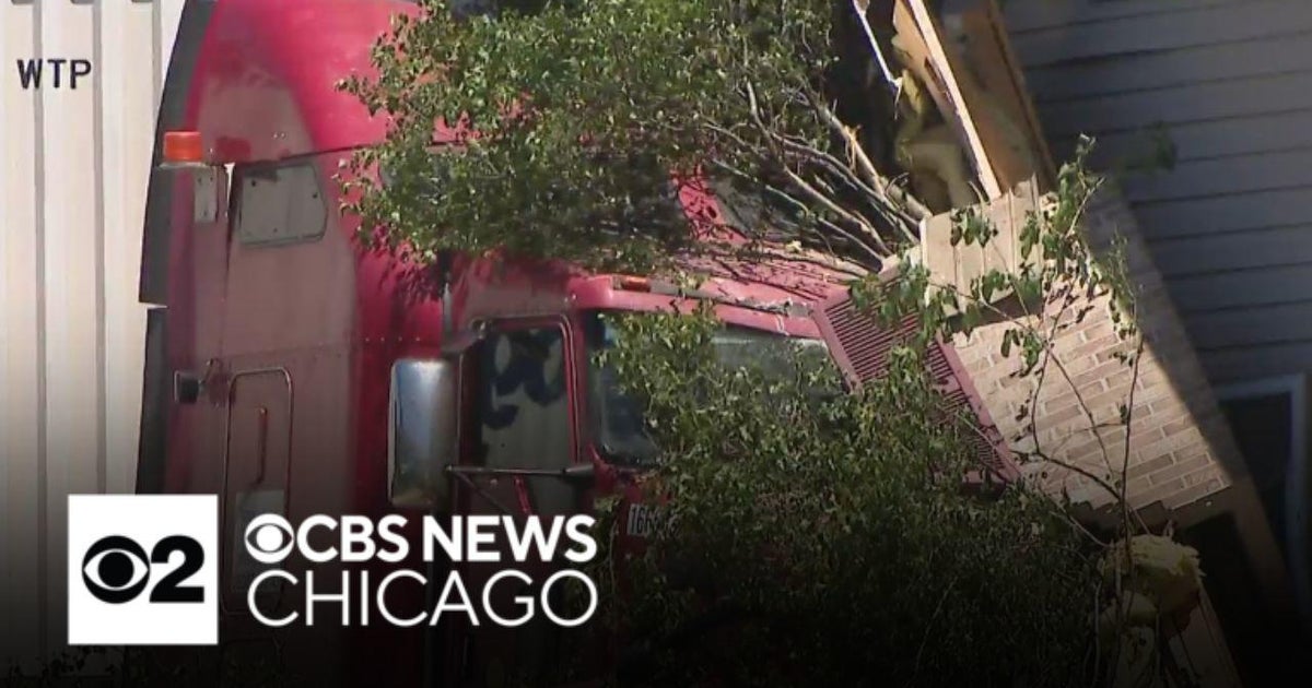 Semi-trailer truck plows into apartment building in Morris, Illinois ...