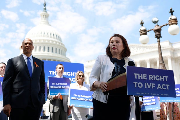 Sen. Tammy Duckworth speaks alongside Sen. Cory Booker outside of the U.S. Capitol on June 12, 2024, in Washington, D.C.