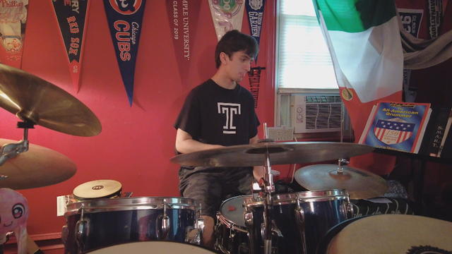 Cole Steiner plays on a drum set 