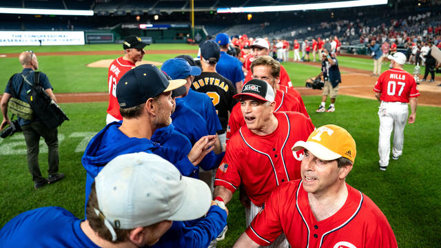 Members of the Democrat and Republican teams shake hands following the Congressional Baseball Game for Charity at National's Park on June 12, 2024 in Washington, DC. 