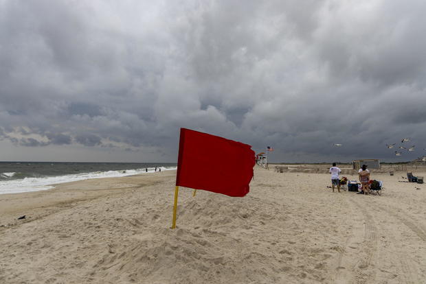 A red flag on a Long Island beach after reported shark sighting 