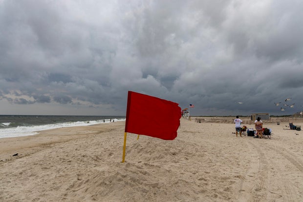 A red flag on a Long Island beach after reported shark sighting
