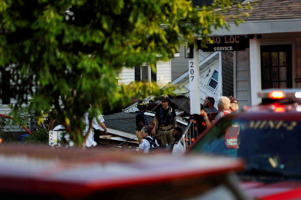 House collapses after suspected gas explosion in Syracuse, New York 