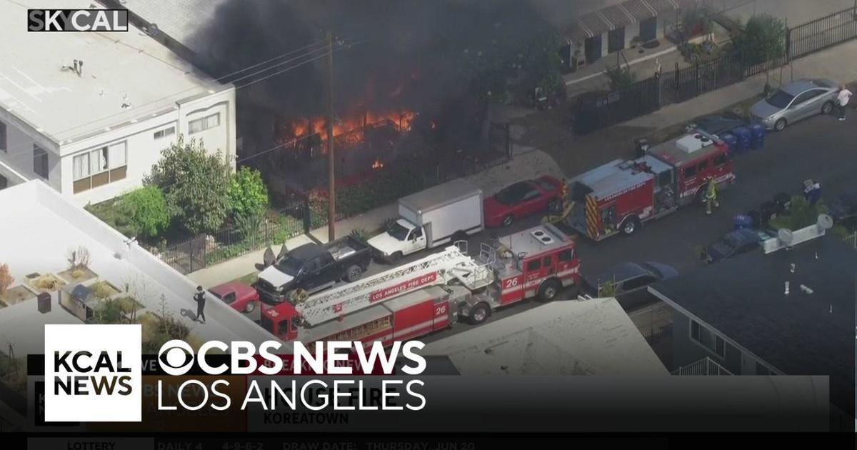 Firefighters work to put out Koreatown house fire - CBS Los Angeles