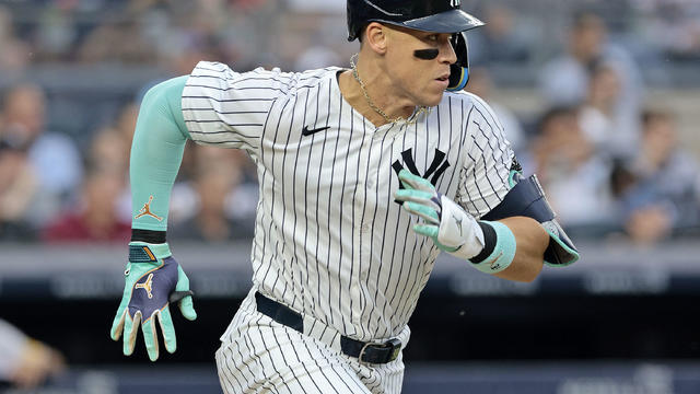 Aaron Judge #99 of the New York Yankees runs up the first base line after grounding into a double play that resulted in an RBI in the bottom of the third inning during the game against the Atlanta Braves at Yankee Stadium on June 22, 2024 in New York City 