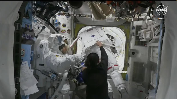 Astronauts return after canceled spacewalk 