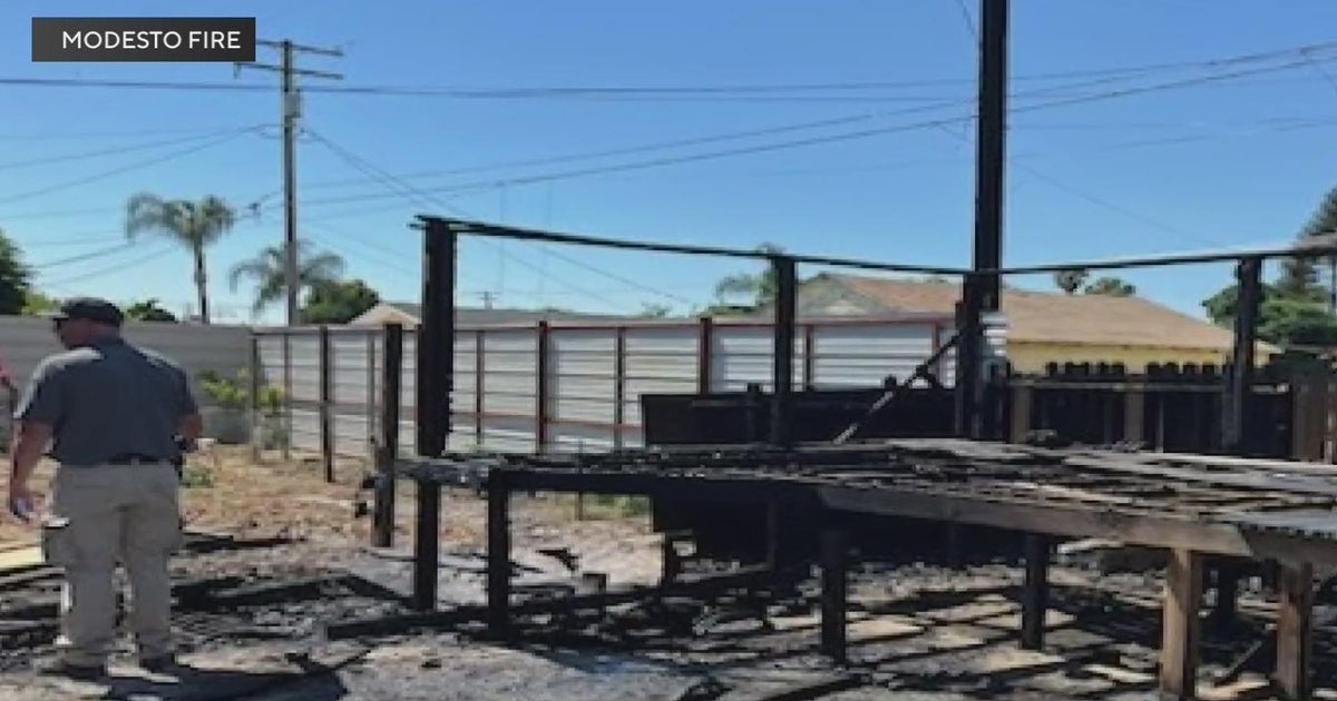 Crews knock down brush fire in Modesto alley