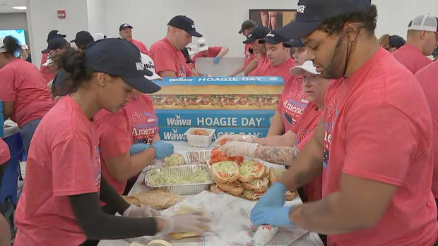 Wawa employees building hoagies for free Hoagie Day 