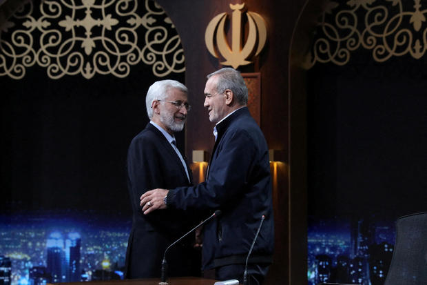 FILE PHOTO: Presidential candidates Masoud Pezeshkian and Saeed Jalili attend an election debate, in Tehran 