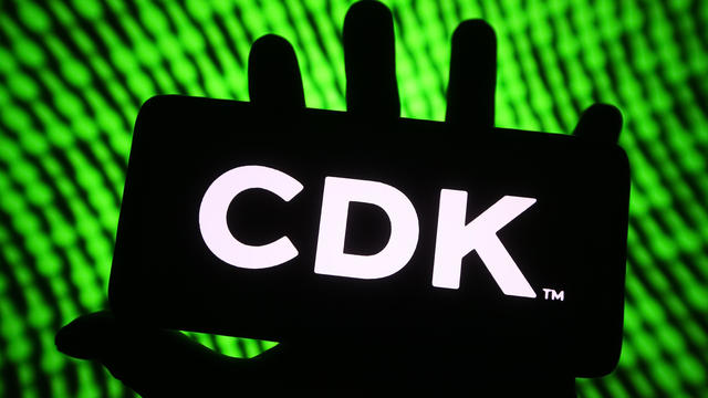 In this photo illustration, a CDK Global Inc. logo is seen 