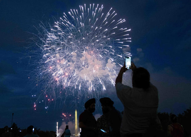Spectators watch the fireworks show on July 4th in Washington, D.C. 