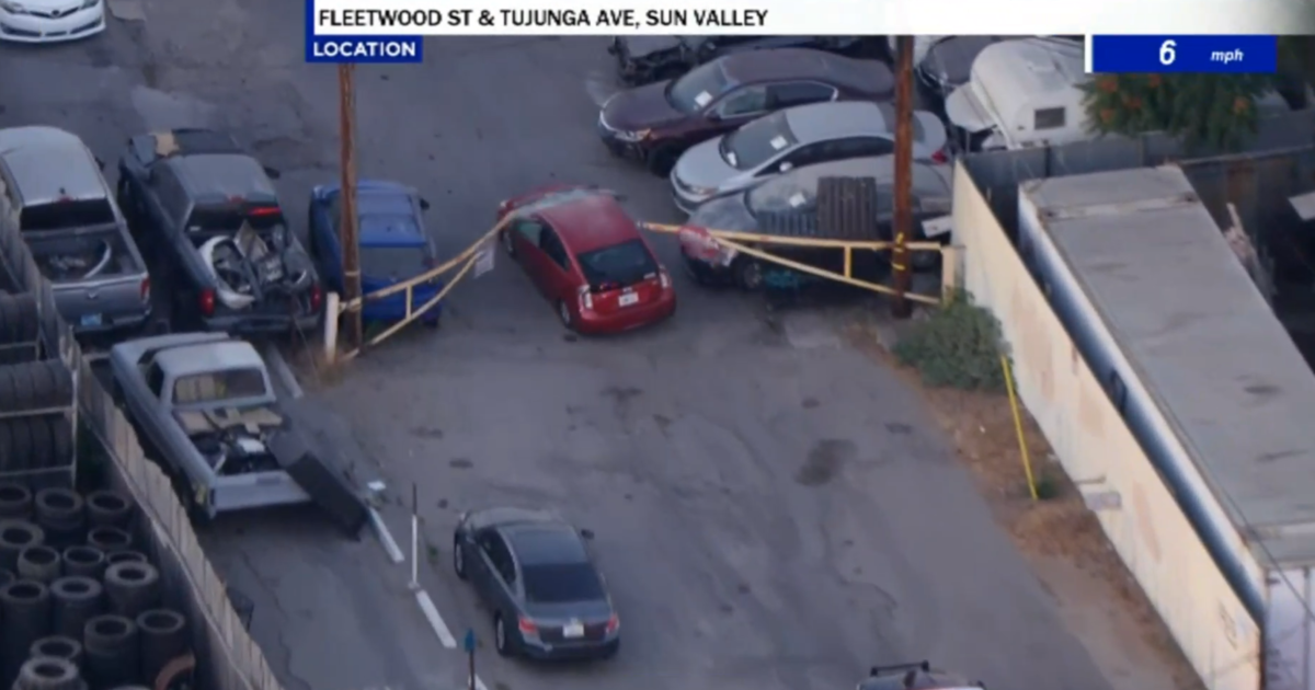Police chase stolen Prius that drove through gate in San Fernando Valley during chase