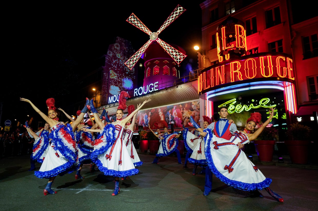 Moulin Rouge's iconic windmill sails restored after collapse just in