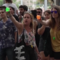 Mass tourism protesters in Barcelona, Spain, spray water at tourists