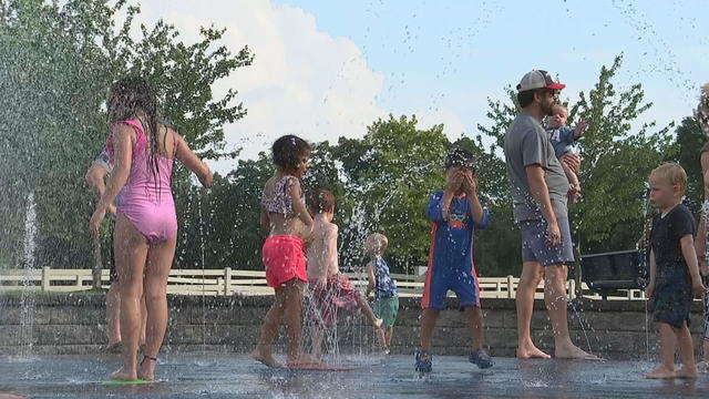 Children play in a sprinkler in Deptford, New Jersey 