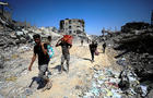 Palestinians inspect damage, after Israeli forces withdrew from Shejaiya neighborhood, in eastern part of Gaza city 
