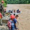 Dozens missing after landslide sweeps buses into monsoon-swollen river