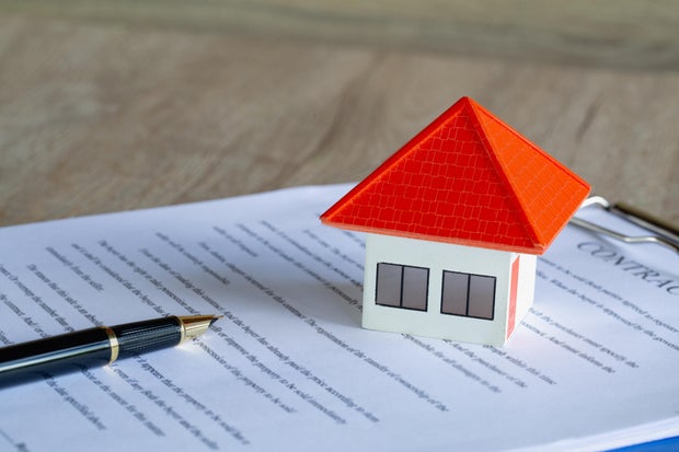 Orange Roof House The idea of contracting a house, real estate rental, mortgage, doing business together.