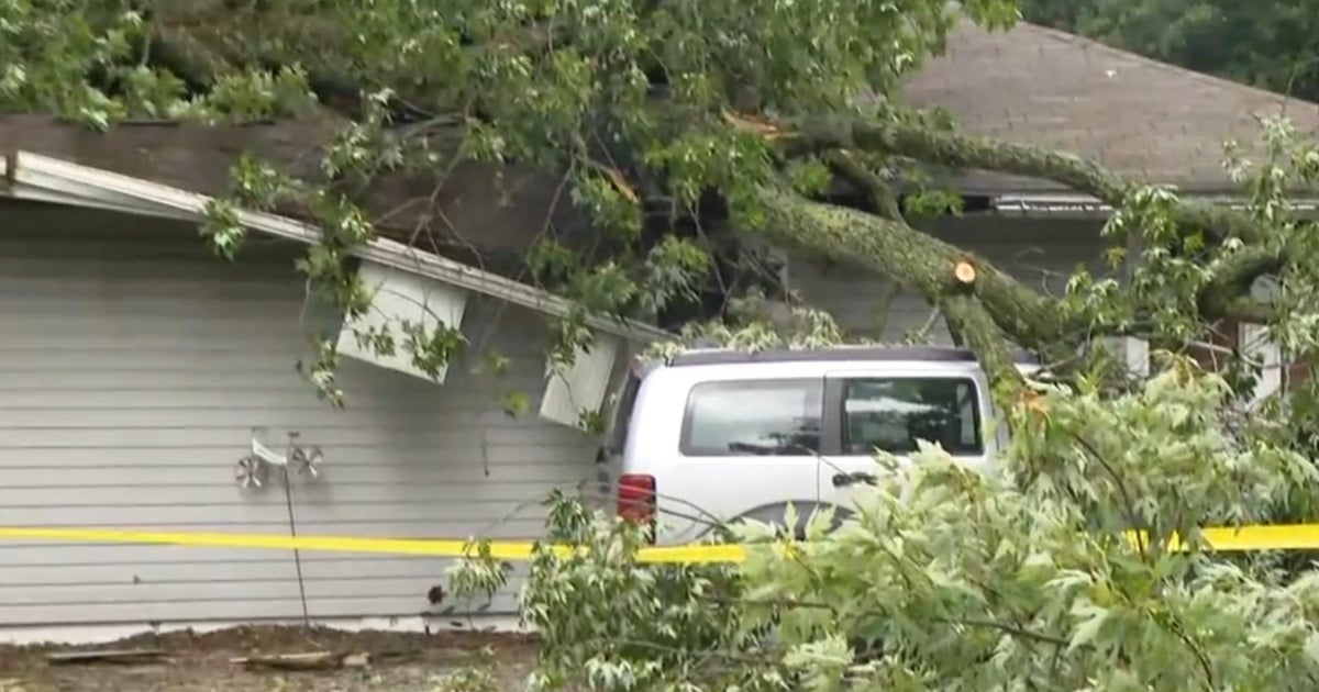 Woman killed after tree falls on home as severe storms roll through ...