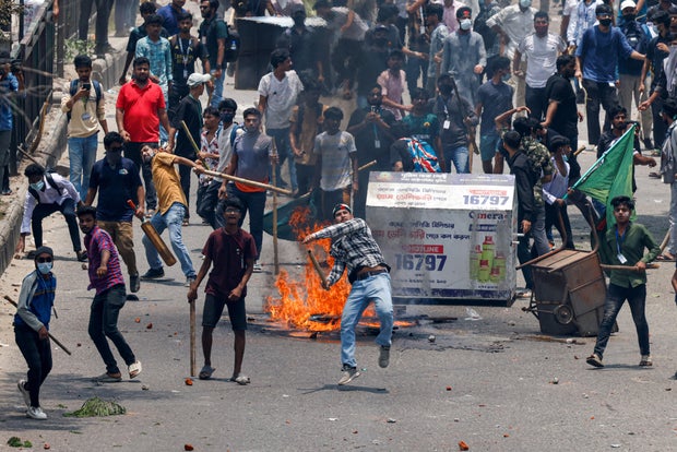 Anti-quota supporters clash with police and Awami League supporters at the Rampura area in Dhaka