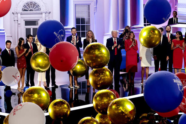 Balloons drop as former President Donald Trump and his family stand onstage during the Republican National Convention at the Fiserv Forum in Milwaukee, Wisconsin, on Thursday, July 18, 2024. 