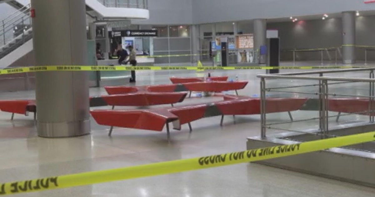 Woman stabbed at MIA, almost thrown over balcony; man arrested - CBS Miami