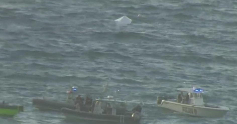 Two people were rescued after their boat capsized near Crandon Park