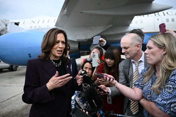 Vice President Kamala Harris speaks to reporters upon arrival at Joint Base Andrews in Maryland on July 25, 2024. 
