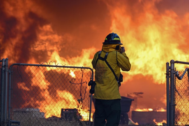 Smoke and flames rise as crews try to extinguish a wildfire in Chico, California, July 25, 2024.