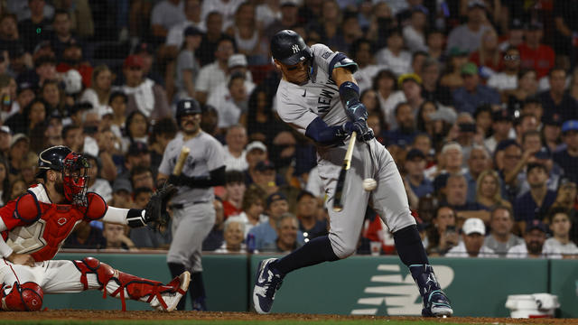 Aaron Judge #99 of the New York Yankees connects on a three-run home run against the Boston Red Sox during the seventh inning at Fenway Park on July 26, 2024 in Boston, Massachusetts. 