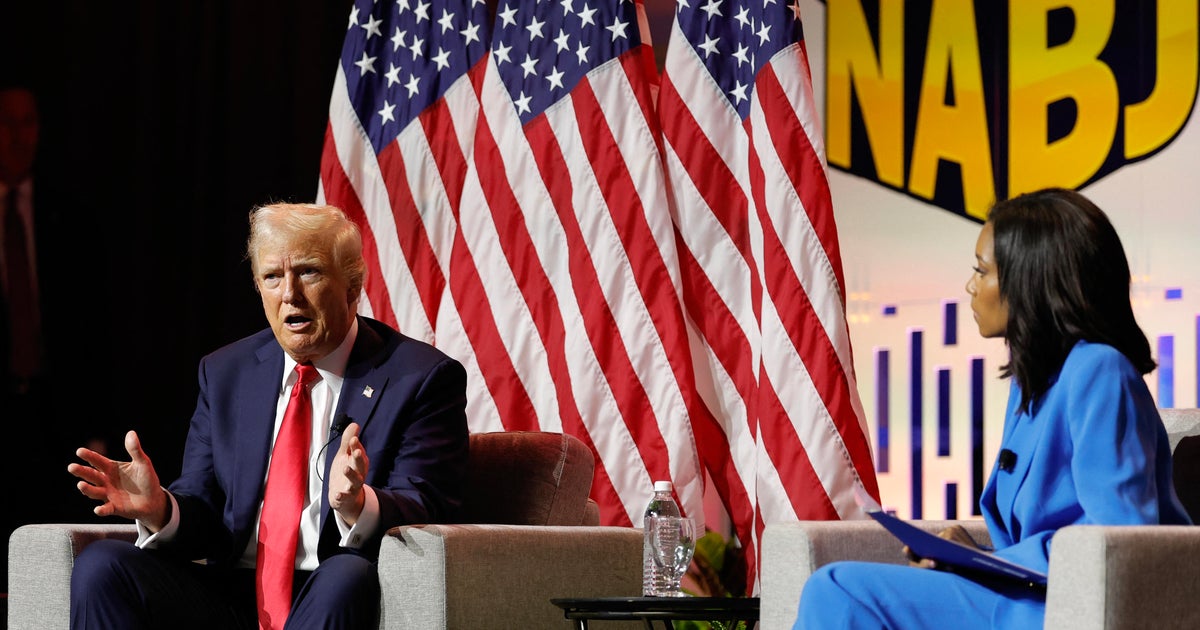 Trump falsely attacks Kamala Harris over race, saying she "happened to turn Black"