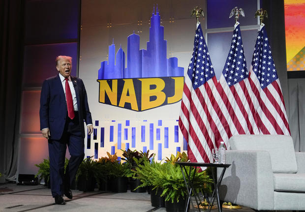 Former President Donald Trump walks on stage at the National Association of Black Journalists convention, on Wednesday, July 31, 2024, in Chicago. 