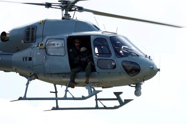 A French Air Force helicopter carrying snipers takes part in a presentation of the drone monitoring operation at the Villacoublay military airport near Paris, France