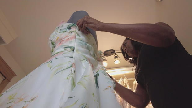 Debbi Collins working in her bridal shop, The Dress Matters 