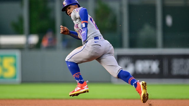 Francisco Lindor #12 of the New York Mets steals second base in the first inning against the Colorado Rockies at Coors Field on August 7, 2024 in Denver, Colorado. 