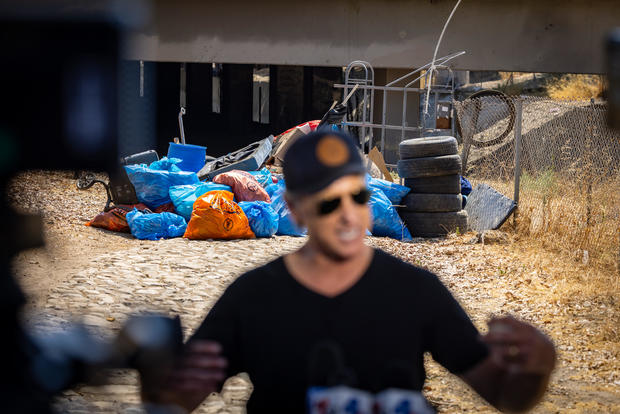 Governor Gavin Newsom along with Caltrans clean up an encampement site near Paxton Street and Remick Avenue in Los Angeles as the state's Clean California initiative continues 