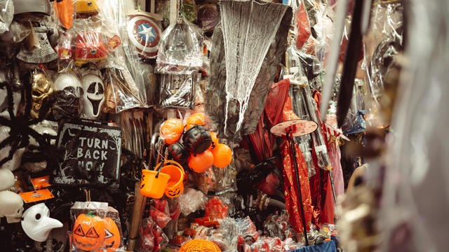 Halloween decorations and costumes prominently displayed at Sampheng market during the Halloween holidays. 