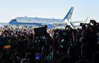 Crowd of supporters wait for a Harris-Walz campaign rally at Detroit airport 